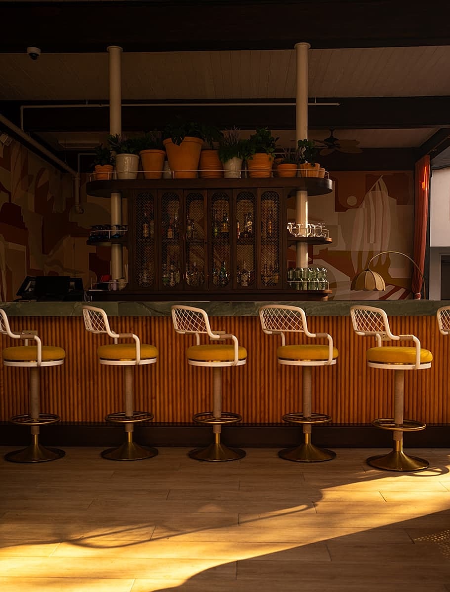 Stylish bar area with colorful seating and decor.